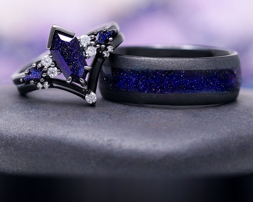 Starry Night™ Couples Ring Set by Aquamarise, featuring black-finished bands with sparkling galaxy sandstone and clear accent stones, from Matching Couples' Rings and Night Court Jewelry collections.