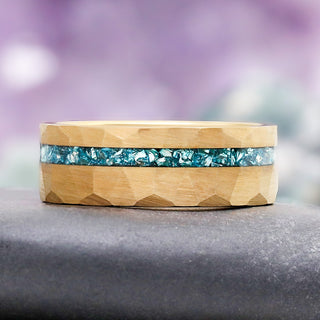 Aquamarine Mens Wedding Band in Gold Tungsten Carbide (8mm) by Aquamarise, featuring a hammered gold tungsten band with a crushed aquamarine stone inlay, part of men's wedding bands collection.