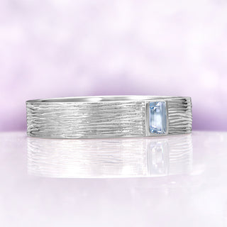 Celtic Aquamarine Couples Ring Set by Aquamarise, featuring a textured sterling silver band with a rectangular aquamarine stone, symbolizing unity in matching couples rings.