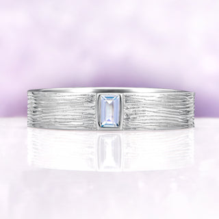 Celtic Aquamarine Couples Ring Set by Aquamarise, featuring a textured sterling silver band with a rectangular aquamarine center stone, symbolizing unity and timeless love.