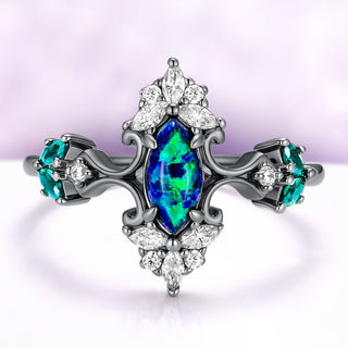 Artemisia Marquise Peacock Fire Opal Engagement Ring in Black Ruthenium by Aquamarise, blue-green marquise opal between scrolled shoulders with teal side stones