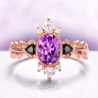 Aurelia Amethyst & Black Onyx Leaf Engagement Ring in 14K Solid Rose Gold by Aquamarise Gold, featuring an oval amethyst center with black onyx accents and delicate leaf-inspired band design.