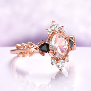 Aurelia Morganite & Black Onyx Leaf Engagement Ring in 14K Solid Rose Gold by Aquamarise Gold, featuring an oval morganite, black onyx, sparkling white stones, and a nature-inspired leaf band.
