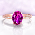 Ava Pink Tourmaline Engagement Ring in 14K Rose Gold Vermeil by Aquamarise, featuring an oval pink tourmaline center and diamond accents on a sleek rose gold vermeil band.