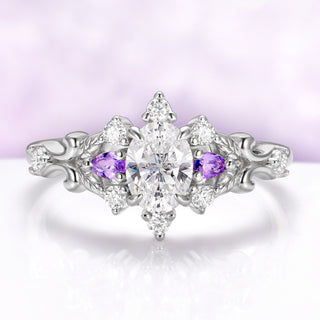 Carmilla engagement ring in sterling silver, oval moissanite between natural amethyst pears with carved leaf and vine shoulders