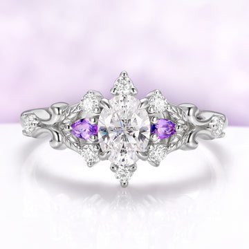 Carmilla engagement ring in sterling silver, oval moissanite between natural amethyst pears with carved leaf and vine shoulders