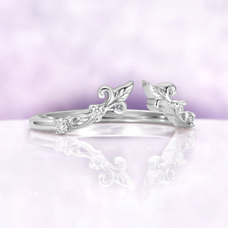 Angled view of the sterling silver Carmilla ring enhancer showing the open front and three moissanite on each shoulder