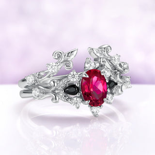 Angled view of the Carmilla ruby bridal set showing the black onyx pears, cubic zirconia accents and carved scrollwork
