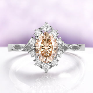 Champagne Moissanite Vintage Engagement Ring in 14K White Gold by Aquamarise Gold, showcasing an oval champagne moissanite center with a diamond halo and detailed vintage-inspired band design.