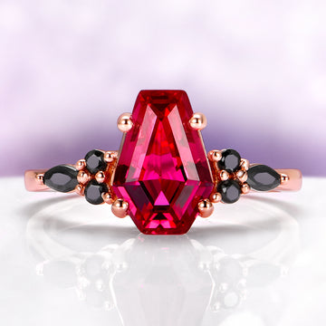 Coffin Cut Ruby and Rose Gold Leaf Couples Ring Set featuring a bold coffin-cut ruby center with black diamond accents on a rose gold band by Aquamarise.