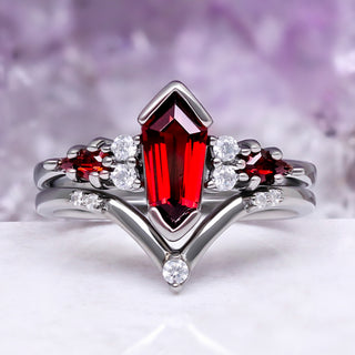 Coffin Kite Natural Red Garnet Ring Set in Black Ruthenium by Aquamarise, front view showing the coffin-cut garnet and diamond accents.