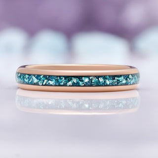 Close-up of the crushed aquamarine inlay against the polished rose gold band