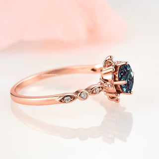 Vintage Alexandrite Fairytale Engagement Ring in 14K Rose Gold Vermeil by Aquamarise, featuring a color-shifting teal and purple alexandrite with delicate diamond accents on a slender rose gold band.