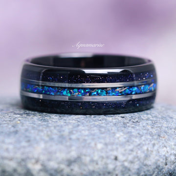 Starry Night and Fire Opal Leaf Couples Ring Set by Aquamarise featuring a black band with shimmering galaxy sandstone and vibrant blue fire opal inlay, part of Matching Couples' Rings, Starry Night™ Rings, and Fantasy-Inspired Jewelry collections.