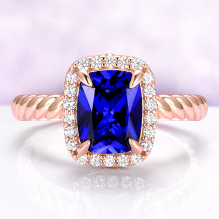 Blue Sapphire Engagement Ring Cushion Cut Ceylon Sapphire on hand over light purple background