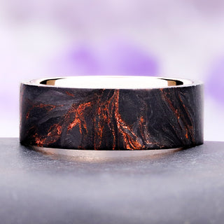 Emberwood men's wedding band, black wood veined with copper wrapped around an 8mm rose gold tungsten core