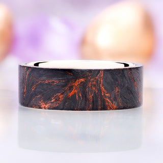 Close view of the copper veining through the black wood on the Emberwood band, rose gold interior visible