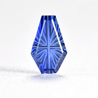 Faelight Cut lab-grown blue sapphire coffin 6 x 10 mm loose gemstone, concave starburst facets, on white