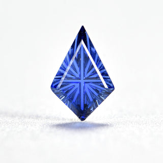 Faelight Cut lab-grown blue sapphire kite 6 x 9 mm loose gemstone, concave starburst facets, on white
