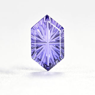 Faelight Cut lab-grown lavender purple sapphire long hexagon 6 x 10 mm loose gemstone, concave starburst facets, on white