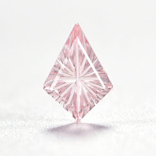 Faelight Cut lab-grown pink sapphire kite 7 x 10 mm loose gemstone, concave starburst facets, on white