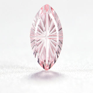 Faelight Cut lab-grown pink sapphire marquise 5 x 10 mm loose gemstone, concave starburst facets, on white