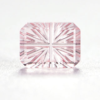 Faelight Cut lab-grown pink sapphire rectangle 6 x 8 mm loose gemstone, concave starburst facets, on white