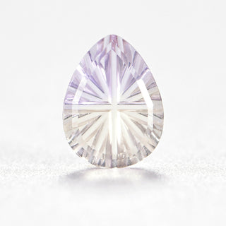 Faelight Cut natural ametrine pear 6 x 8 mm loose gemstone, concave starburst facets, on white