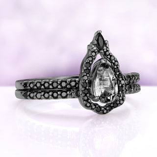 Angled view of the Fairest Herkimer set showing the inclusions in the pear quartz framed by black onyx pavé