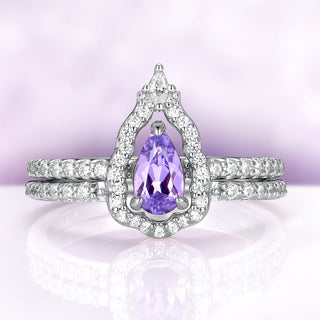 Lavender sapphire engagement ring set — pear lab-grown lavender sapphire on a pavé band with an open mirror-shaped halo band in sterling silver by Aquamarise