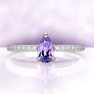 Pear lavender sapphire solitaire shown on its own, front view with simulated diamond pavé along the shank