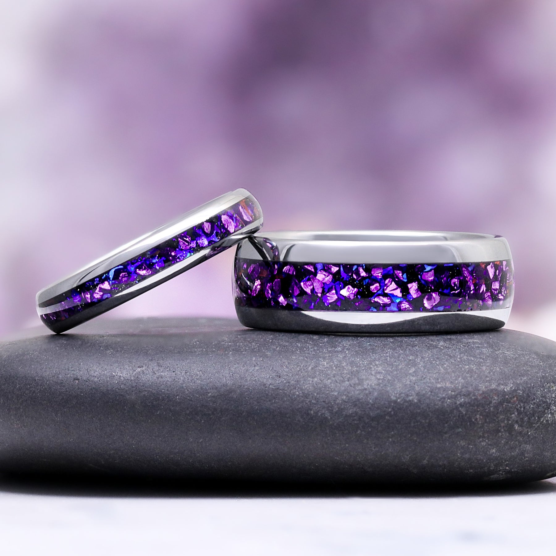 Galaxy Alexandrite & Fire Opal Tungsten Couples Ring Set by Aquamarise, featuring crushed purple alexandrite inlay within polished tungsten bands for matching couples rings.