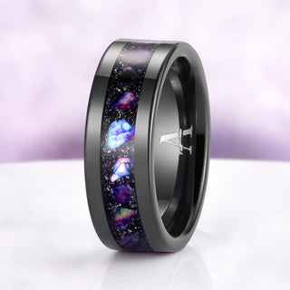 Black ring with colorful inlay on a white background