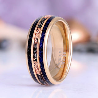 Galaxy Sandstone Couples Ring Set by Aquamarise, featuring a rose gold tungsten band with glittering blue sandstone and textured metallic inlay from Matching Couples' Rings and Starry Night™ collections.