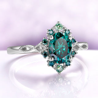 Green Moissanite Vintage Engagement Ring in 14K White Gold by Aquamarise Gold, featuring an oval green moissanite center with detailed vintage-inspired halo and intricately designed band.