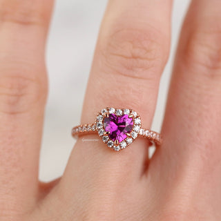 Heart Cut Ruby Promise Ring in 14K Rose Gold Vermeil by Aquamarise, featuring a vibrant heart-shaped ruby center surrounded by a diamond halo on a rose gold vermeil band.