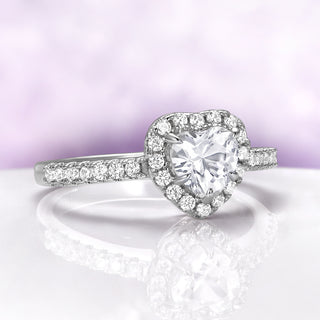 Heart White Sapphire Promise Ring in Sterling Silver by Aquamarise, featuring a heart-shaped white sapphire surrounded by sparkling stones on a polished sterling silver band.