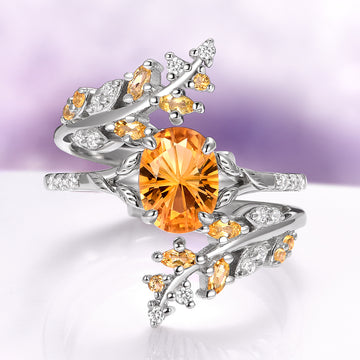 Fantasy Cut Citrine Couples Ring Set by Aquamarise, featuring a silver band with a radiant oval citrine center stone and intricate branches accented with small citrine and sparkling white gemstones, part of Matching Couples' Rings and Fantasy-Inspired Jewelry collections.