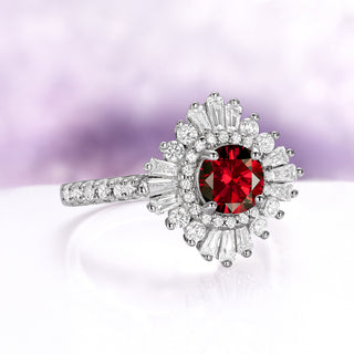 Joelle Vintage Natural Red Garnet Ring in Sterling Silver featuring a deep red garnet center surrounded by baguette and round white stones in an Art Deco design by Aquamarise.