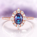 Astra Oval Cut Alexandrite Engagement Ring in 14K Rose Gold Vermeil by Aquamarise, featuring an oval alexandrite center with diamond halo and pavé diamond accents on the rose gold band.