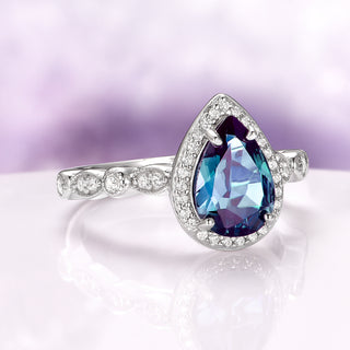 Vintage Teardrop Alexandrite Ring in Sterling Silver by Aquamarise, showcasing a pear-shaped alexandrite with pavé diamond halo and detailed sterling silver band from Sterling Silver Rings collection.