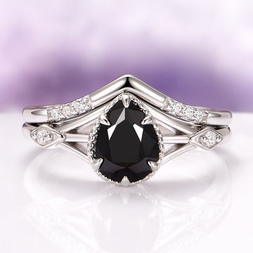 Celtic Black Onyx Couples Ring Set by Aquamarise featuring a pear-cut black onyx and sterling silver bands with diamond accents from Matching Couples' Rings collection.