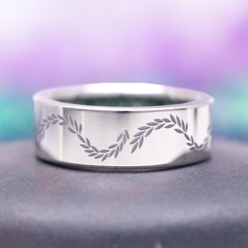 Moss Agate & Emerald Fairy Leaf Couples Ring Set by Aquamarise, featuring a sleek silver band engraved with a delicate swirling leaf pattern, part of Matching Couples' Rings and Nature-Inspired Jewelry collections.