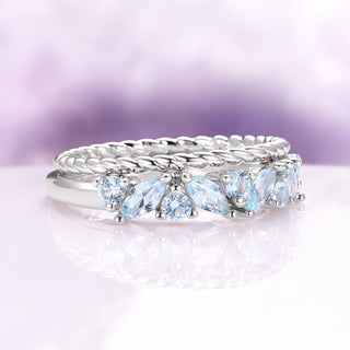 Willow Marquise Aquamarine Stacking Ring Set in Sterling Silver by Aquamarise featuring shimmering marquise and round aquamarine stones on a twisted and polished silver band for elegant stacking.