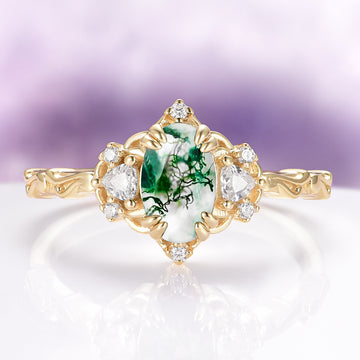 Esme Green Moss Agate Fairy Engagement Ring in 14K Solid Yellow Gold by Aquamarise Gold, featuring an oval moss agate with diamond accents and intricate yellow gold detailing.