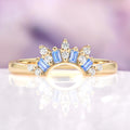 Blue Moissanite Crown Band in 14K Yellow Gold by Aquamarise Gold, showcasing pastel blue baguette moissanites and sparkling round stones arranged in a delicate crown design, part of Women’s Wedding Bands, Birthstone Jewelry, and Gold Rings collections.