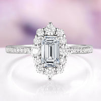 Emerald Cut Lab-Grown Diamond Engagement Ring in 14K White Gold (IGI Certified) by Aquamarise Gold, featuring scalloped pavé diamonds and a diamond-encrusted gallery.