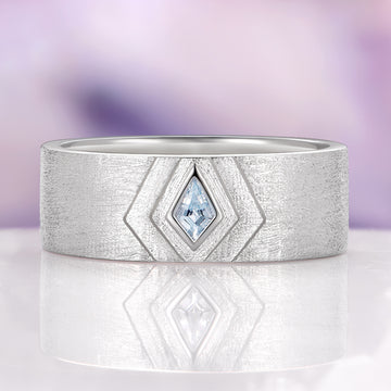 Elowen Aquamarine Couples Ring Set by Aquamarise features a modern sterling silver band with a rhodium finish, showcasing a unique kite-shaped aquamarine gemstone, part of Matching Couples' Rings and March Birthstone Jewelry collections.