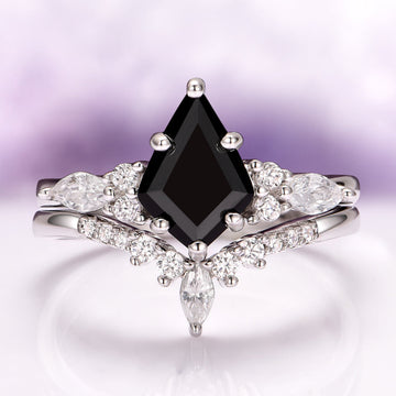 Skye Kite™ Black Onyx Couples Ring Set by Aquamarise featuring a kite-cut black onyx center stone with marquise and round white gemstones on a polished silver band.