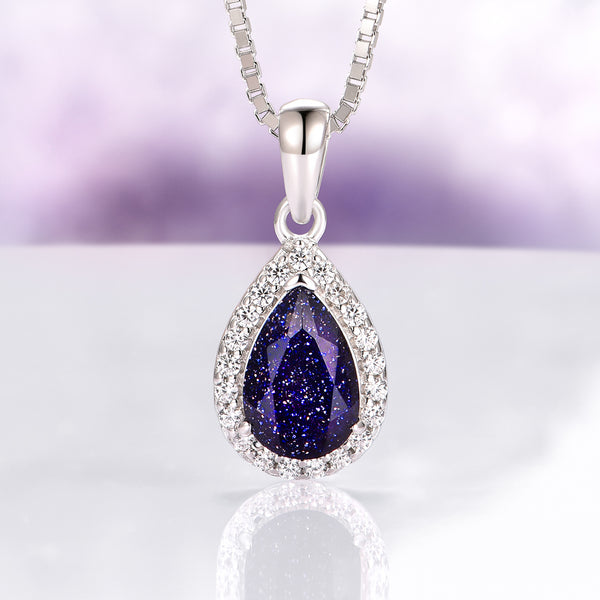 Vera Starry Night Necklace in Sterling Silver by Aquamarise featuring a pear-shaped dark blue sandstone teardrop surrounded by sparkling crystals, inspired by celestial Night Court jewelry collections.